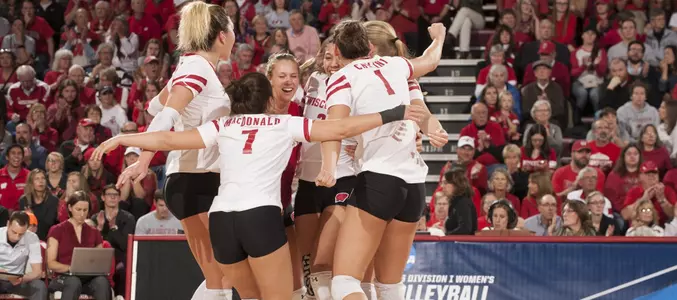 The Badger team celebrates on the floor