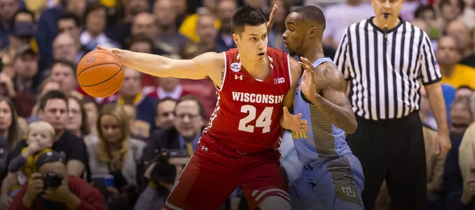 Bronson Koenig posts up a defender during a game at Marquette