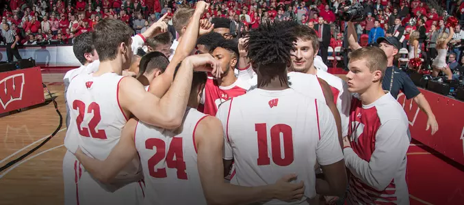 Men's basketball team huddle