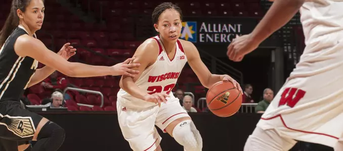 Cayla McMorris drives around a defender