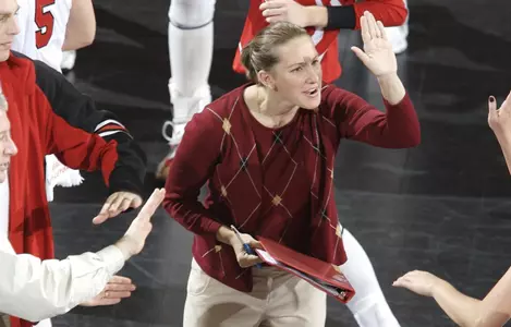 Colleen Bayer congratulates a player