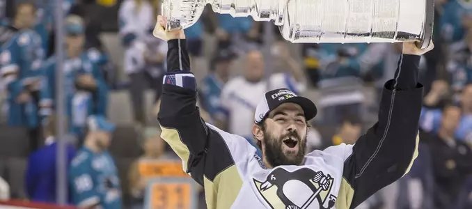Justin Schultz carries the Stanley Cup