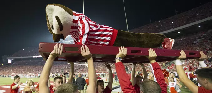 Bucky Badger does push-ups during football game
