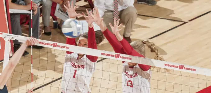 Lauren Carlini and Haleigh Nelson go up for a block