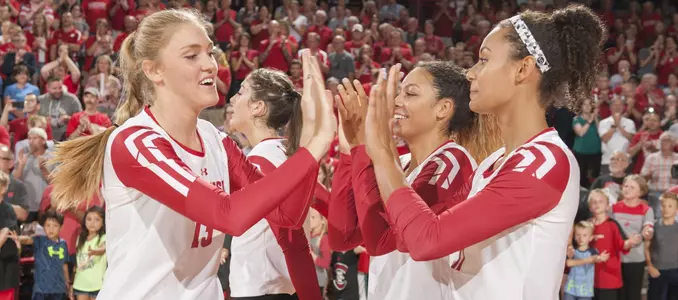 Haleigh Nelson slpas the hands of her teammates during starting lineups
