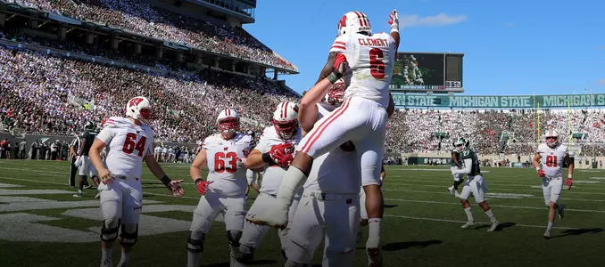 Corey Clement celebrates after scoring a touchdown