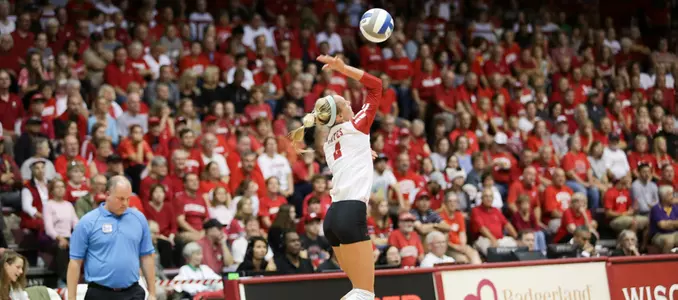 Kelli Bates serves the ball