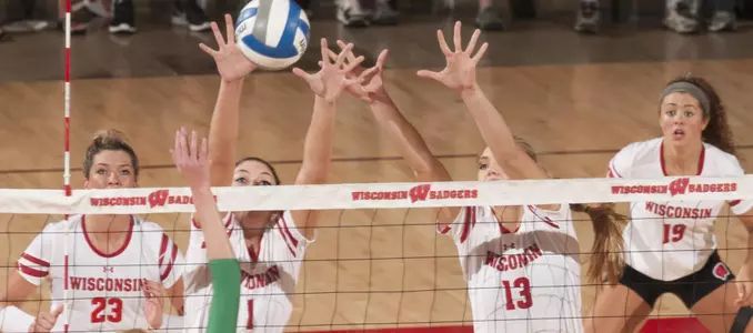 Lauren Carlini and Haleigh Nelson go up for a block