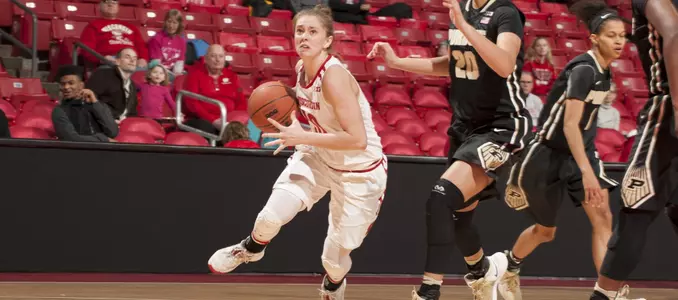 Kendra Van Leeuwen brings the ball up the court