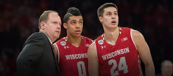 Trice and Koenig with Gard during game vs. Rutgers