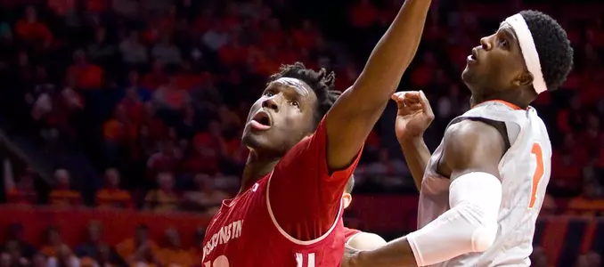 Nigel Hayes goes up for a rebound vs. Illinois