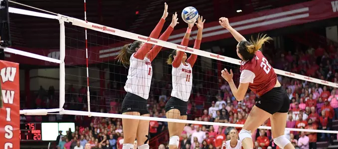 Madison Duello and Tionna Williams attempt to block an Indiana attacker.