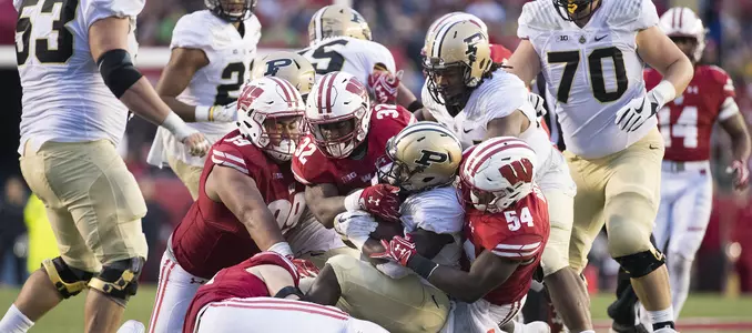 Photo of Leon Jacobs, Chris Orr, Olive Sagapolu defense football vs. Purdue 2017