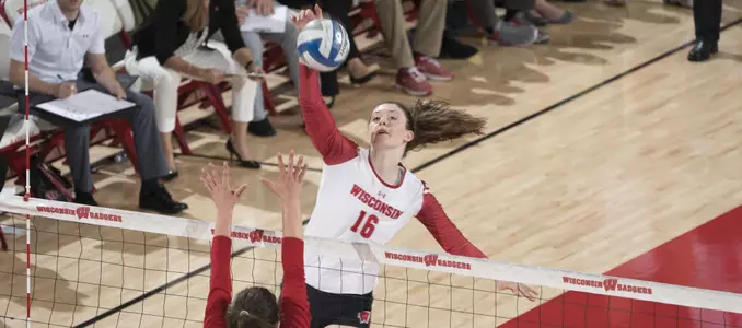 Dana Rettke attacks the ball against one Nebraska blocker.