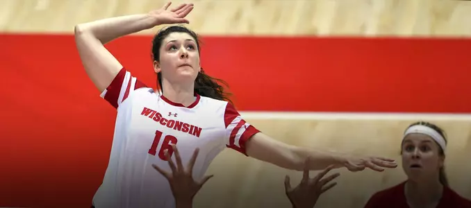 Dana Rettke attacks the ball against a Minnesota blocker