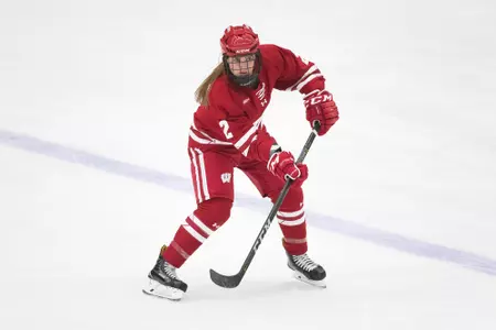 Natalie Buchbinder makes pass on the blue line