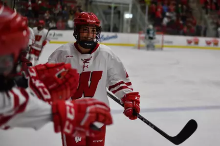 Maddie Rolfes goes through the bench after scoring against BSU