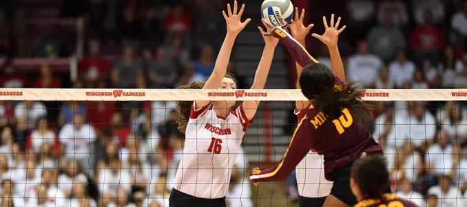 Dana Rettke and Lauryn Gillis block a Minnesota attack.