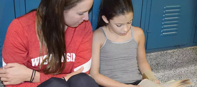 Photo of Jess Unicomb Badgers Give Back pen pal reading