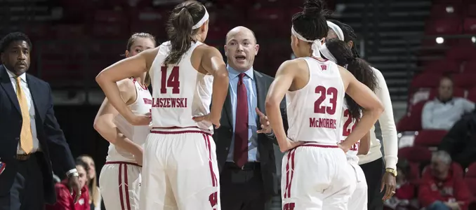 Head coach Jonathan Tsipis talks to his team on the court.