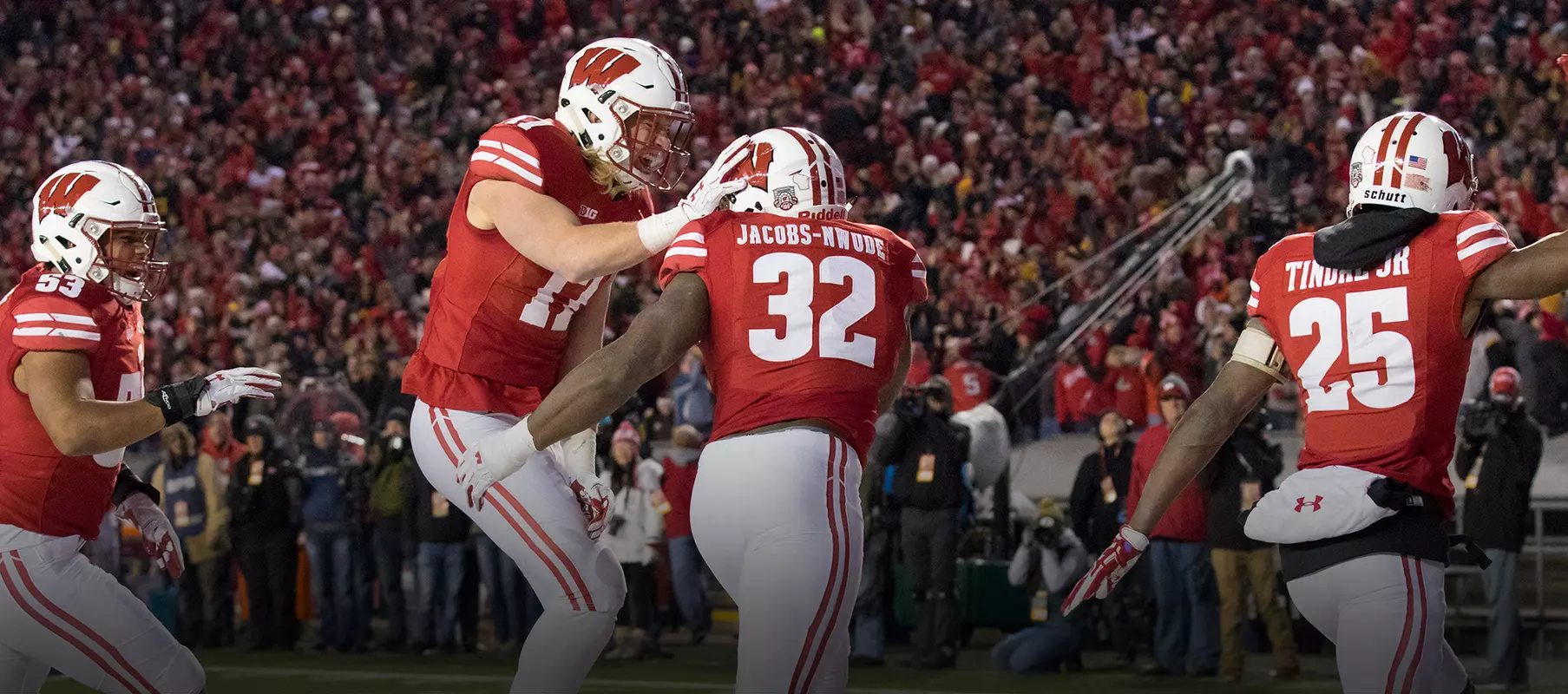 Photo of Leon Jacobs, Andrew Van Ginkel celebrate football win against Iowa 2017