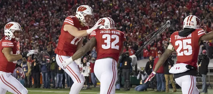Photo of Leon Jacobs, Andrew Van Ginkel celebrate football win against Iowa 2017