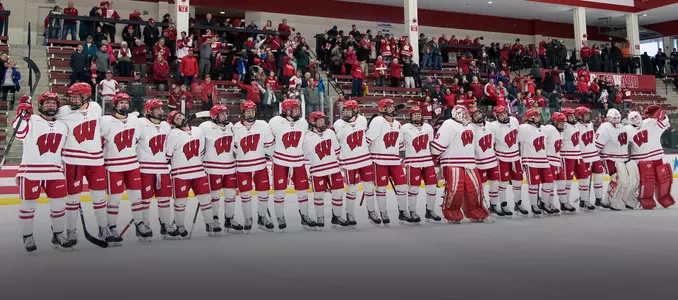 Women's hockey celebrates after a victory