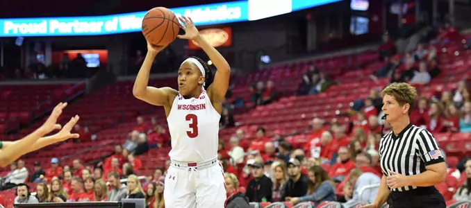 Suzanne Gilreath shoots a three pointer against Charlotte in the Kohl Center.