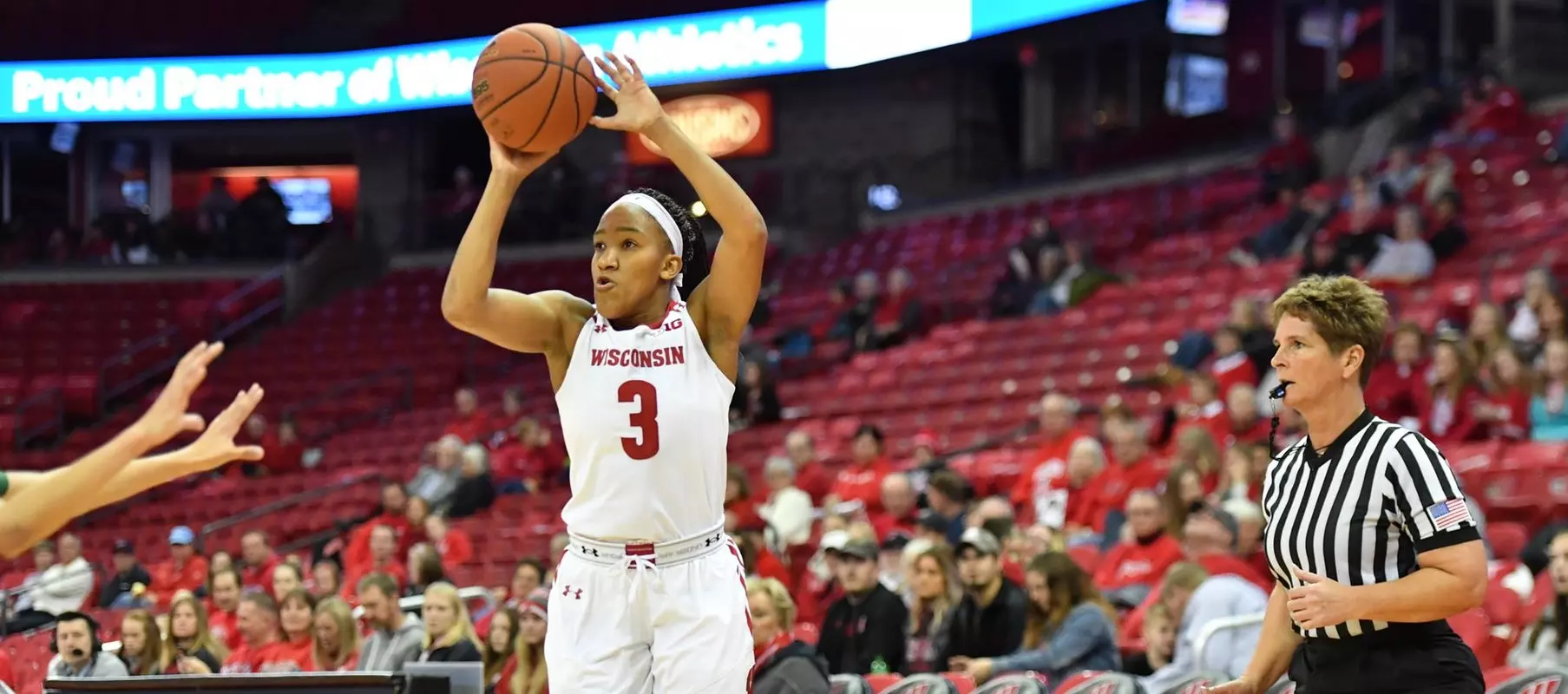 Suzanne Gilreath shoots a three pointer against Charlotte in the Kohl Center.