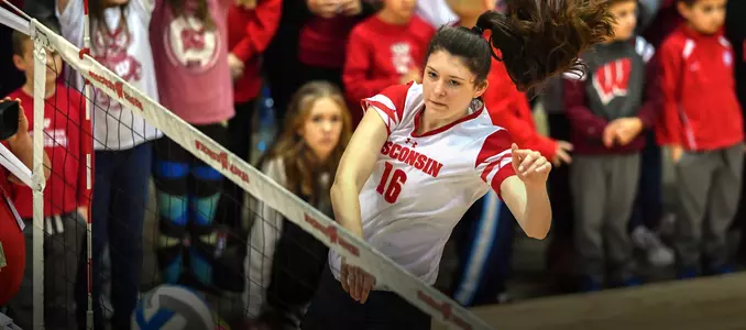Dana Rettke attacks the ball during warm ups in the UW Field House.
