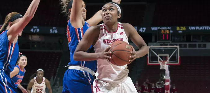 Marsha Howard drives to the basket against two Platteville defenders