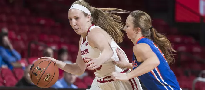 Lizzie Miller drives around a Platteville defender.