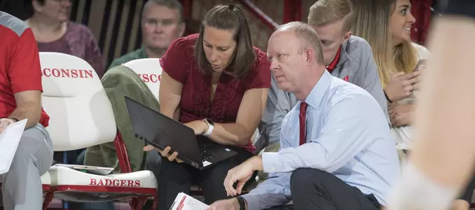 Head coach Kelly Sheffild talks to Colleen Bayer on the bench.