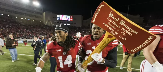 Photo of D'Cota Dixon and Sojourn Shelton with Axe - football vs. Minnesota 2016