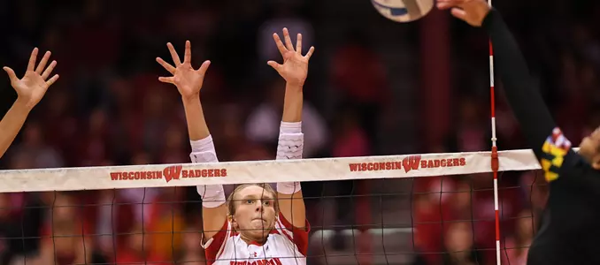 Kelli Bates goes up for a block