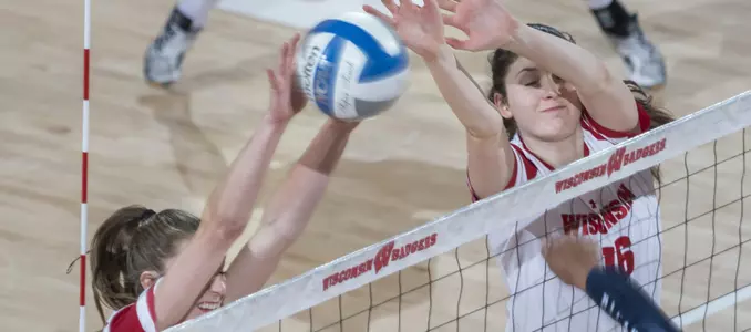 Sydney Hilley and Dana Rettke block a Penn State attack.