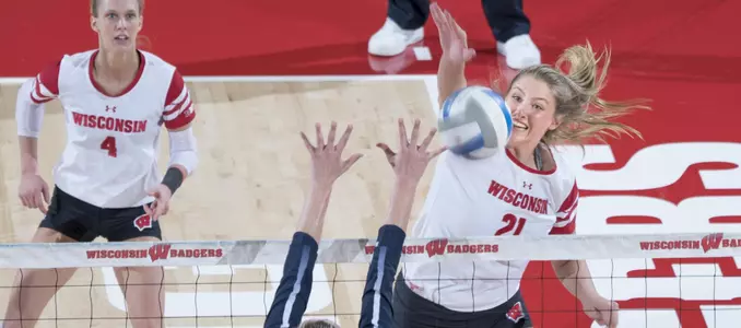 Grace Loberg hits a line shot against a Penn State blocker.