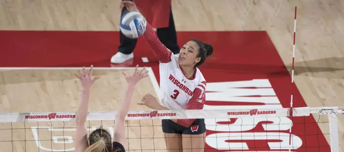 Lauryn Gillis attacks the ball against a Rutgers blocker.
