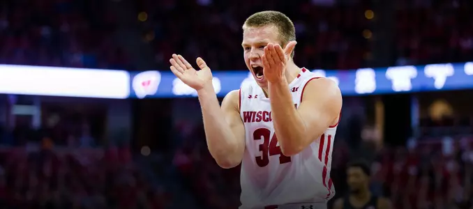 Brad Davison claps in excitement during a game against Xavier