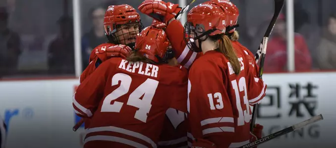 Badgers celebrate a goal in their 4-2 win over BU