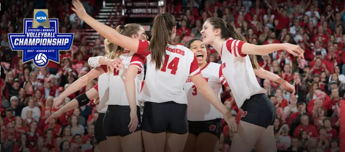 The Badgers celebrate winning a point on the court during the Penn State match.
