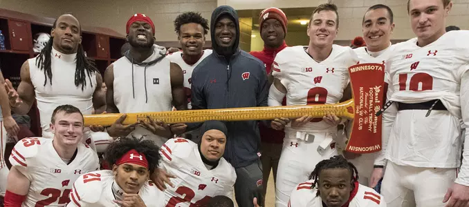 Photo of Defense D'Cota Dixon, Natrell Jamerson, Joe Ferguson and teammates with axe after beating Minnesota, football 2017