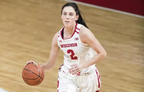 Kelly Karlis dribbles the basketball