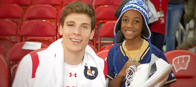 Photo of Ethan Happ shoe kids Badgers Give Back 2017