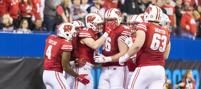 Photo of Troy Fumagalli and teammates celebrate during football game vs. Ohio State in Big Ten Championship Game 2017