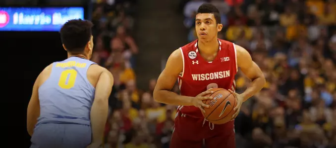 D'Mitrik Trice surveys the court during a game at Marquette
