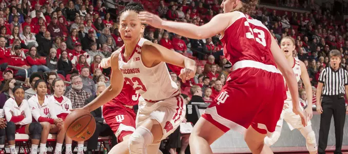 Cayla McMorris drives past a defender