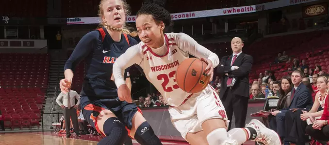 Cayla McMorris drives around an Illini defender