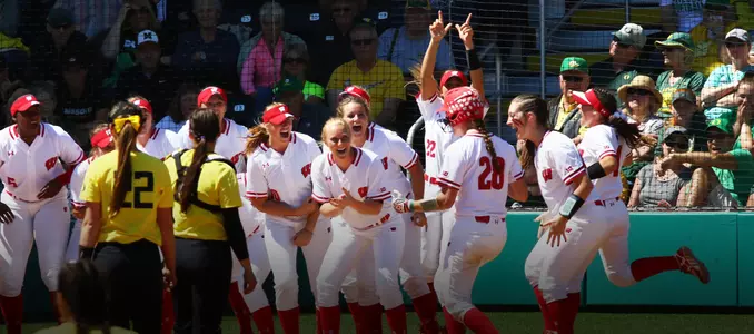 Team celebrates Miller's homer against Oregon
