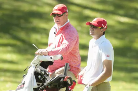 Photo of men's golf coach Michael Burcin and senior Eddie Wajda during the 2016 Badger Invitational at University Ridge